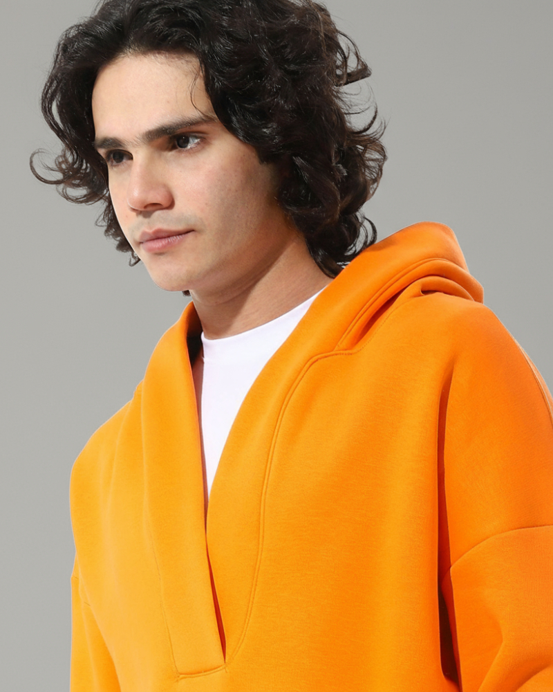 An orange hoodie with a modern cut from Defect